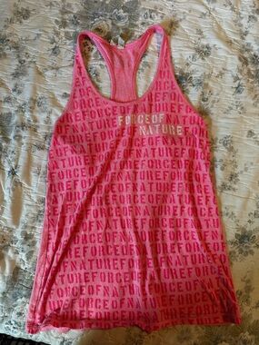 Under Armour Pink Racerback Tank with Repeating 'Force of Nature' Text